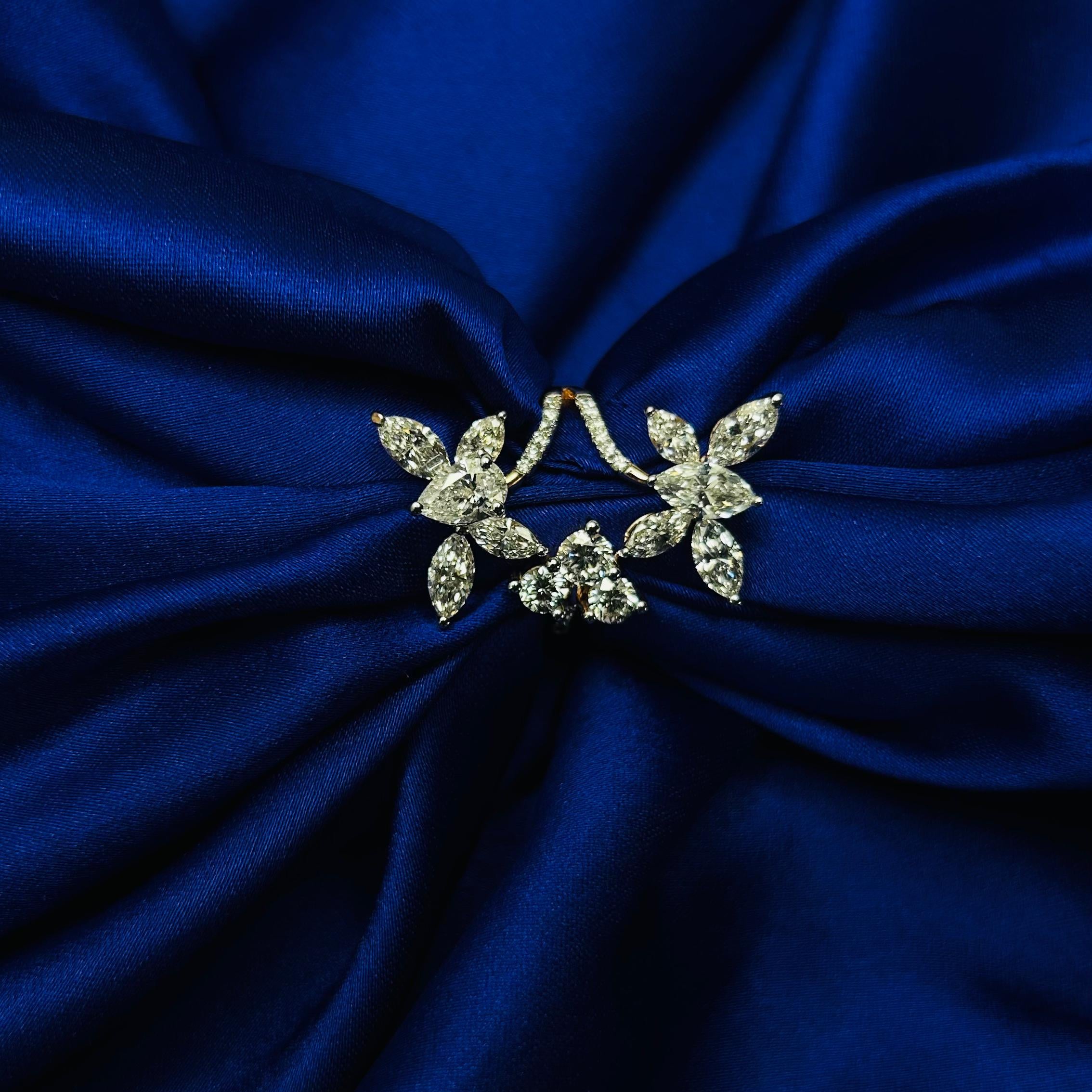 Decorative brooch on a blue fabric background
